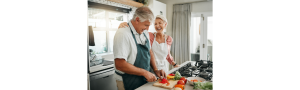 Older Adult couple cooking a meal