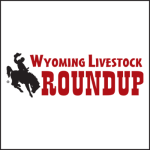 Logo of Wyoming Livestock Roundup with a silhouette of a cowboy on a bucking horse to the left of bold red text.