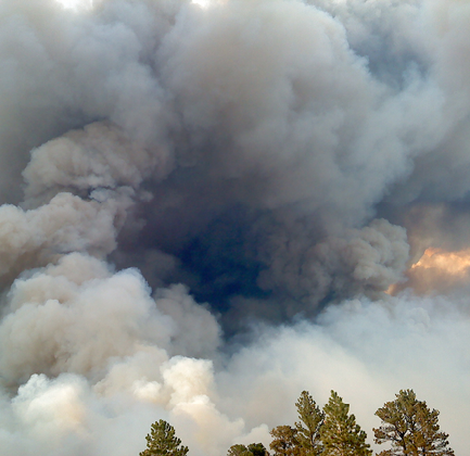 Sky filled with heavy grey and brown smoke clouds 