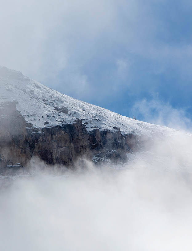 Full-page photo of windswept mountain side blowing snow. Chapter title: Prior to Drought