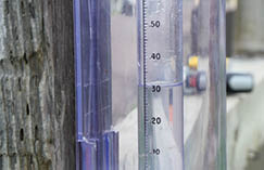 Close up photo of water in a rain gauge