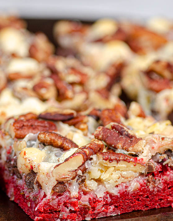 A close up of a red velvet magic cookie bar. 