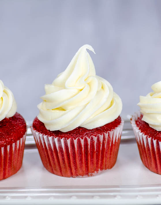 Red velvet cupcakes with white frosting. 