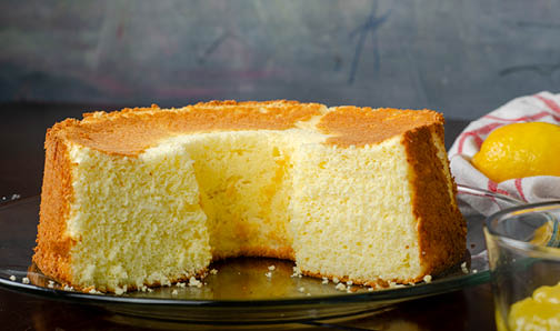 A sponge cake with a piece missing from the center. 