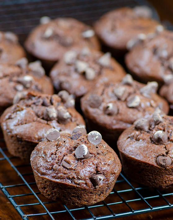 Rows of double chocolate muffins on a cooling rack. 
