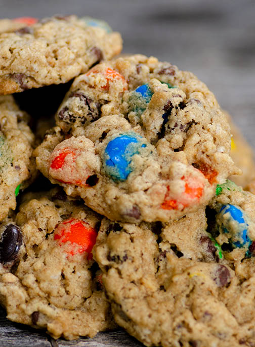 A close up of a pile of Wyoming monster cookies with colorful chunks. 