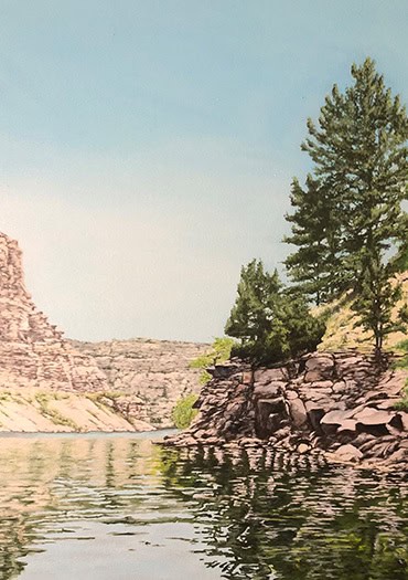 Realistic landscape painting by Lee Lane depicting a rocky shoreline lined with evergreen trees, reflecting in the calm green water of a lake under a clear blue sky.