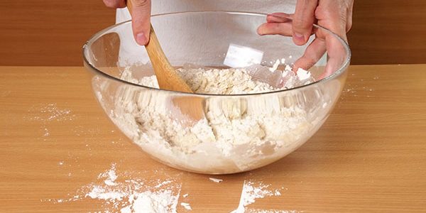 Mixing dry ingredients in a bowl.