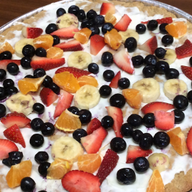 baked fruit pizza on metal pizza tray