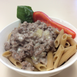 recipe garnished with pepper and spinach in white bowl