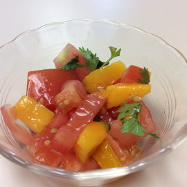 a serving of mango salsa in clear glass bowl