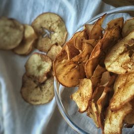 clear bowl of baked apple chips