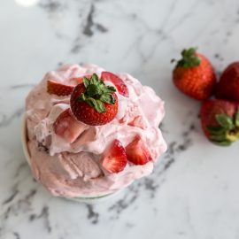 strawberry ice cream in clear dish