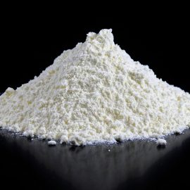 pile of flour on black background