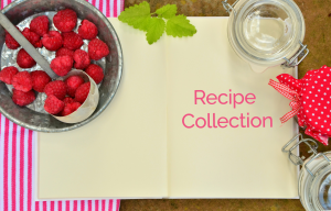 bowl of raspberries, mint leaves, and glass jars on top of a blank book with text "recipe collections" on book