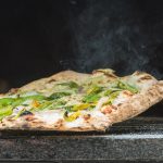 square pizza coming out of pizza oven