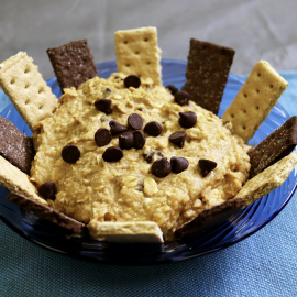 hummus in blue bowl with graham crackers