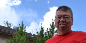Volunteer Gene Johnson waters vegetables, fruits, and herbs at the LaBonte Park Community Garden, one of several community, school, and church gardens in Laramie.