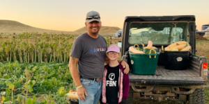 Man and boy standing in garden