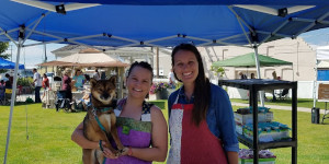 Ladies under tent at farmers market