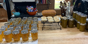 Canned goods and homemade bread in front of a stove