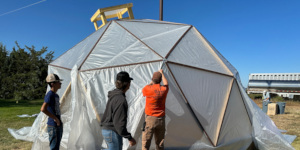 People building a hoop house