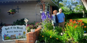 People standing in a garden.