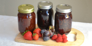 Jars of jam and fresh fruit