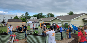 People filling raised beds
