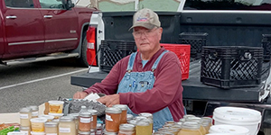 Larry French sitting at a table