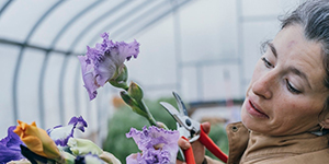 Woman admiring flowers