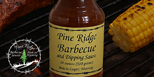 Bottle of sauce and piece of corn