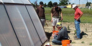 People working on a greenhouse