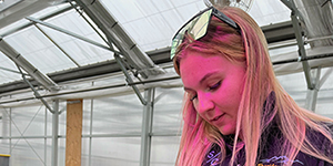 Woman in greenhouse