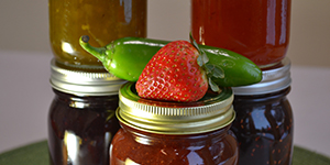 Jars of jam and fresh produce