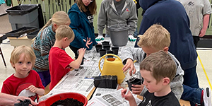 Kids planting seeds