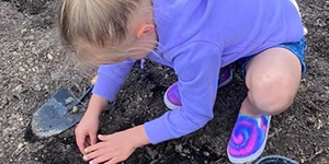 Child planting plants