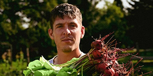 Man holding beets