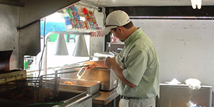 Person testing temperature in a kitchen.