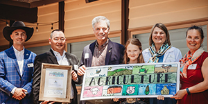 Group holding winning Bookmark & Beyond Contest design.