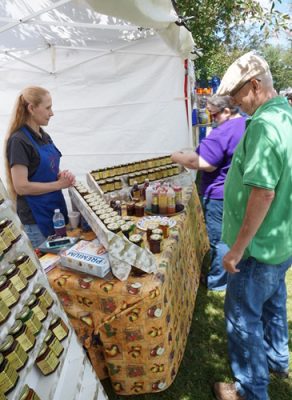 Vendor and buyer at a Farmers Market