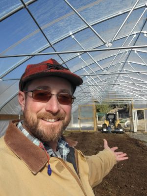 Man in greenhouse