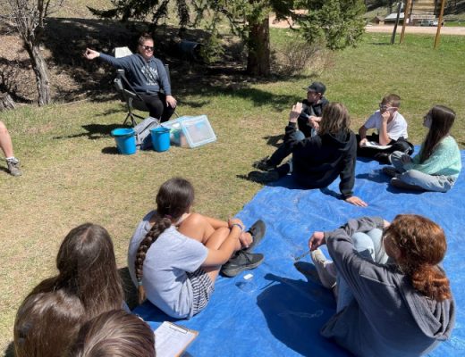 Students learning how to test water quality.