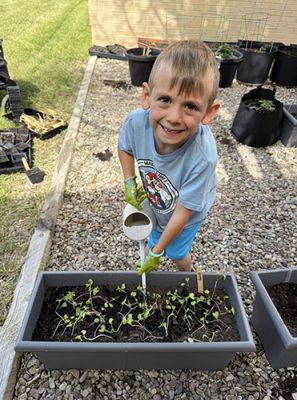 Child working in a garden