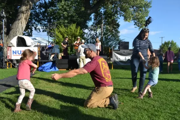 The Downtown Laramie Farmers Market attracts hundreds of shoppers, who not only have a chance to purchase locally produced items, but also socialize and enjoy live music. Pictured are Chris Marcolini and daughter Josie, left, and his wife, Jessie Marcolini and daughter Finley of Laramie.