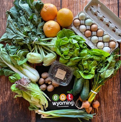 Fresh produce and eggs with Eat Wyoming logo