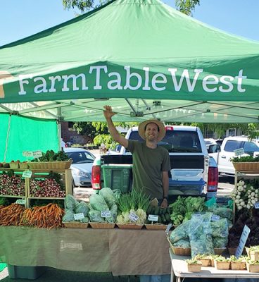 Zach Buchel under FarmTableWest tent