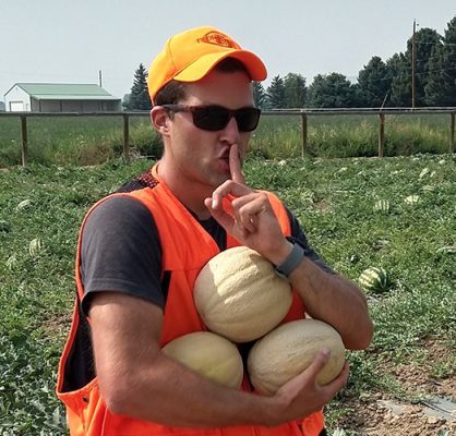 Man holding cantaloupes
