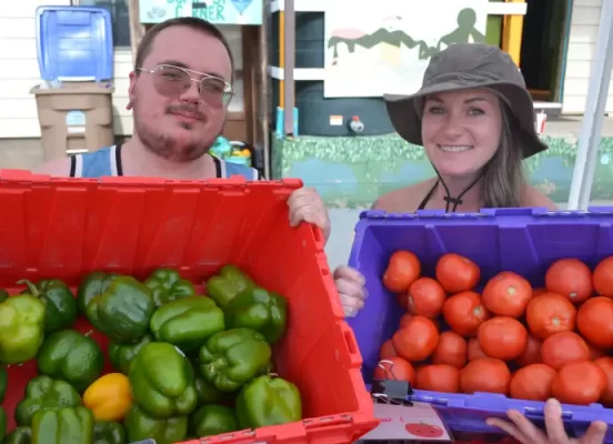 Frankie Thorne, left, and Deni Boersma display some of the fresh produce that is given to people in need by the organization Feeding Laramie Valley.