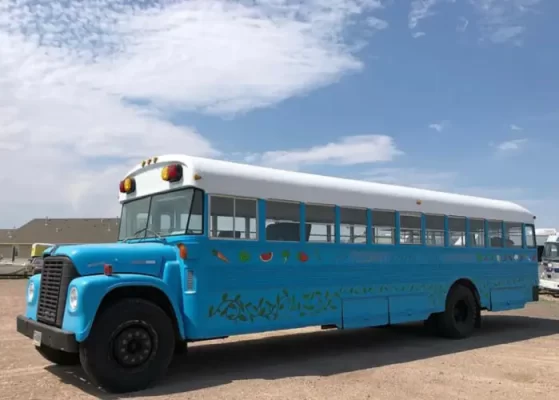 An old Blue Bird bus was converted into a mobile market by Feeding Laramie Valley, and food is now distributed to people in need at several drop-off locations in Albany County.